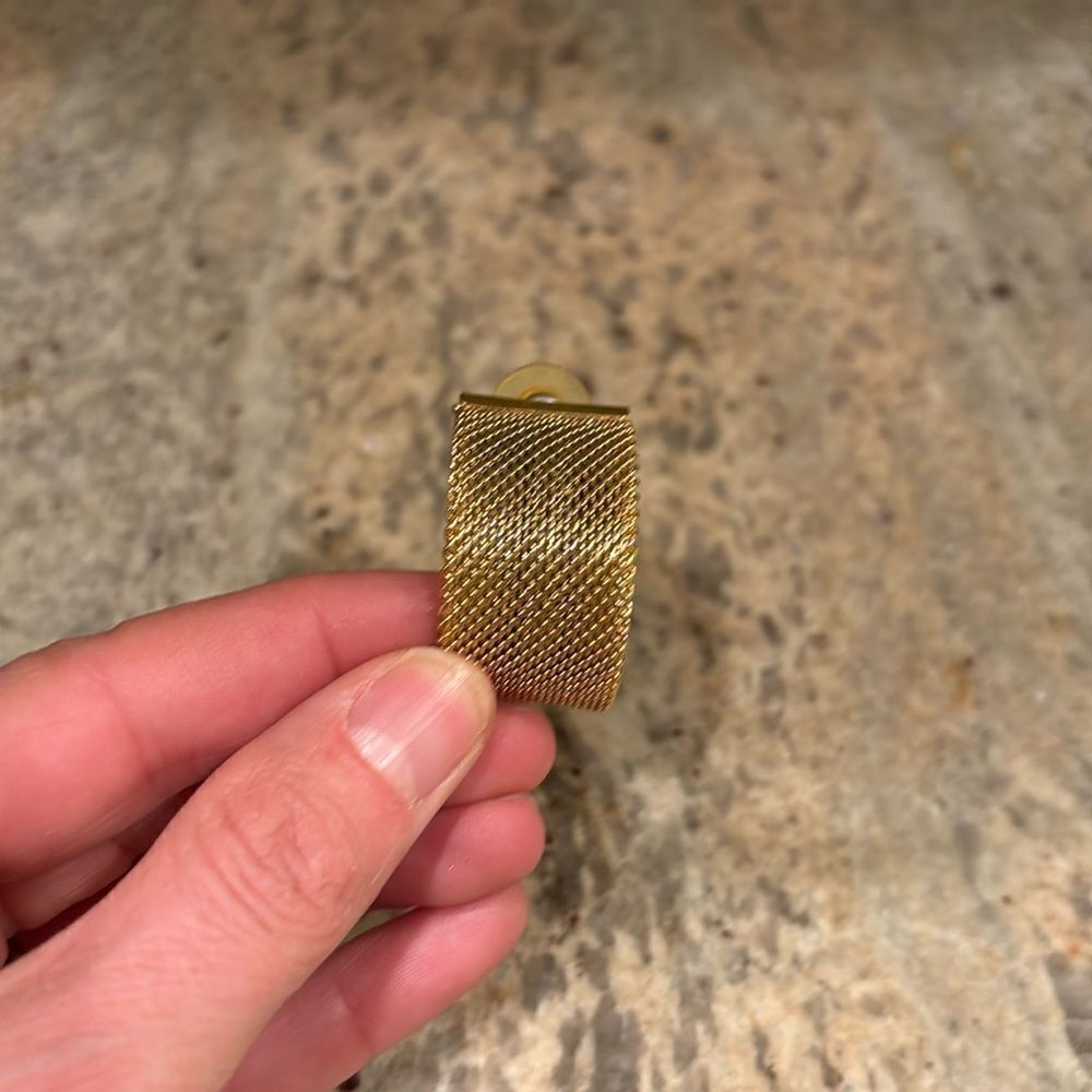 Woman's gold cuff earring. Just one earring